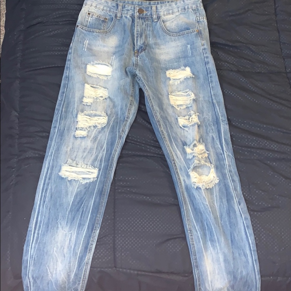 Men’s ripped blue jeans